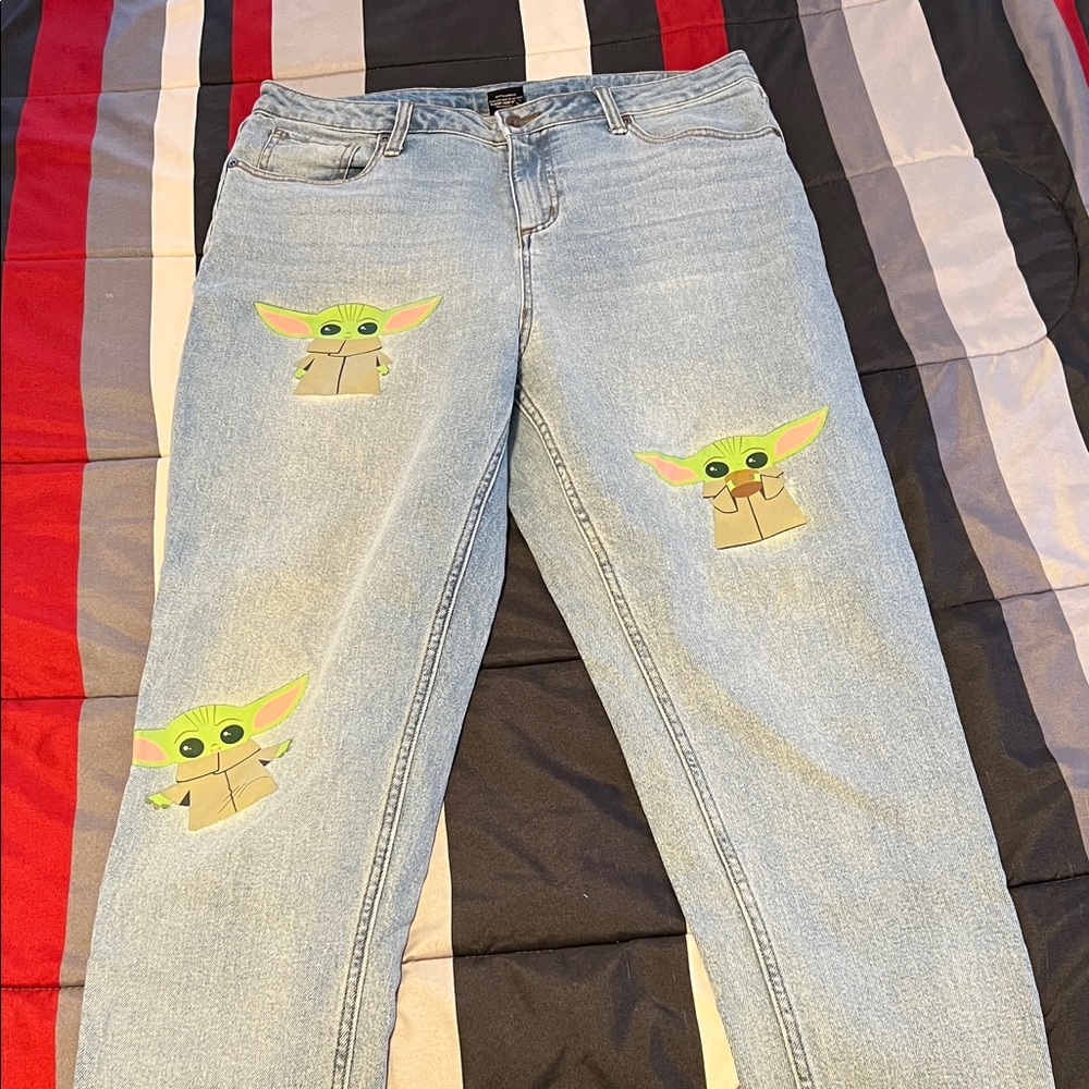 Star Wars Light Wash Women’s Jeans with Baby Yoda Grogu Character Design.